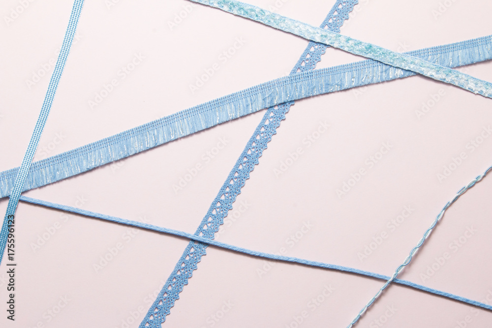 Blue ribbon on paper background