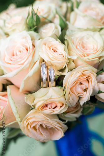 wedding rings on wedding bouquet