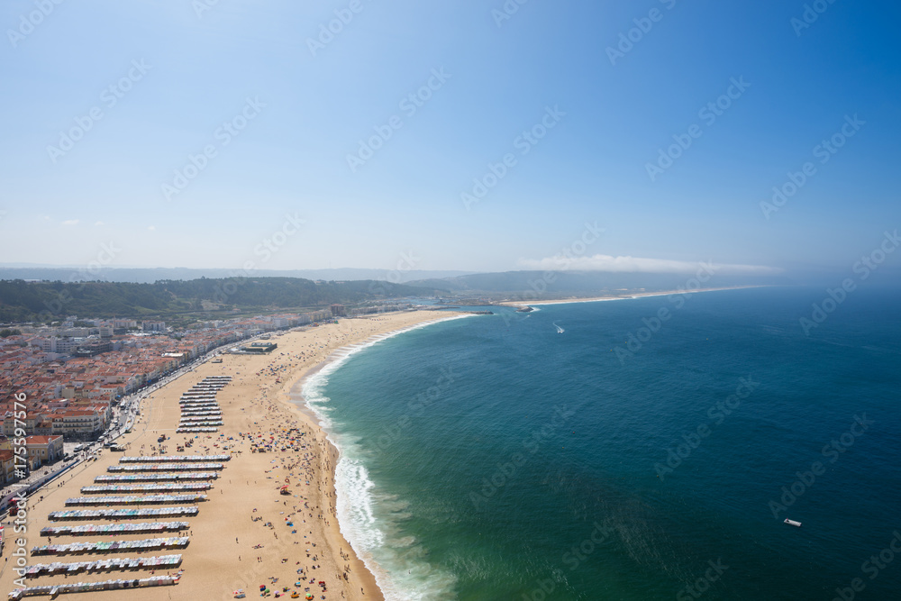 Aerial view of beach in Nazare Portugal at clear summer day