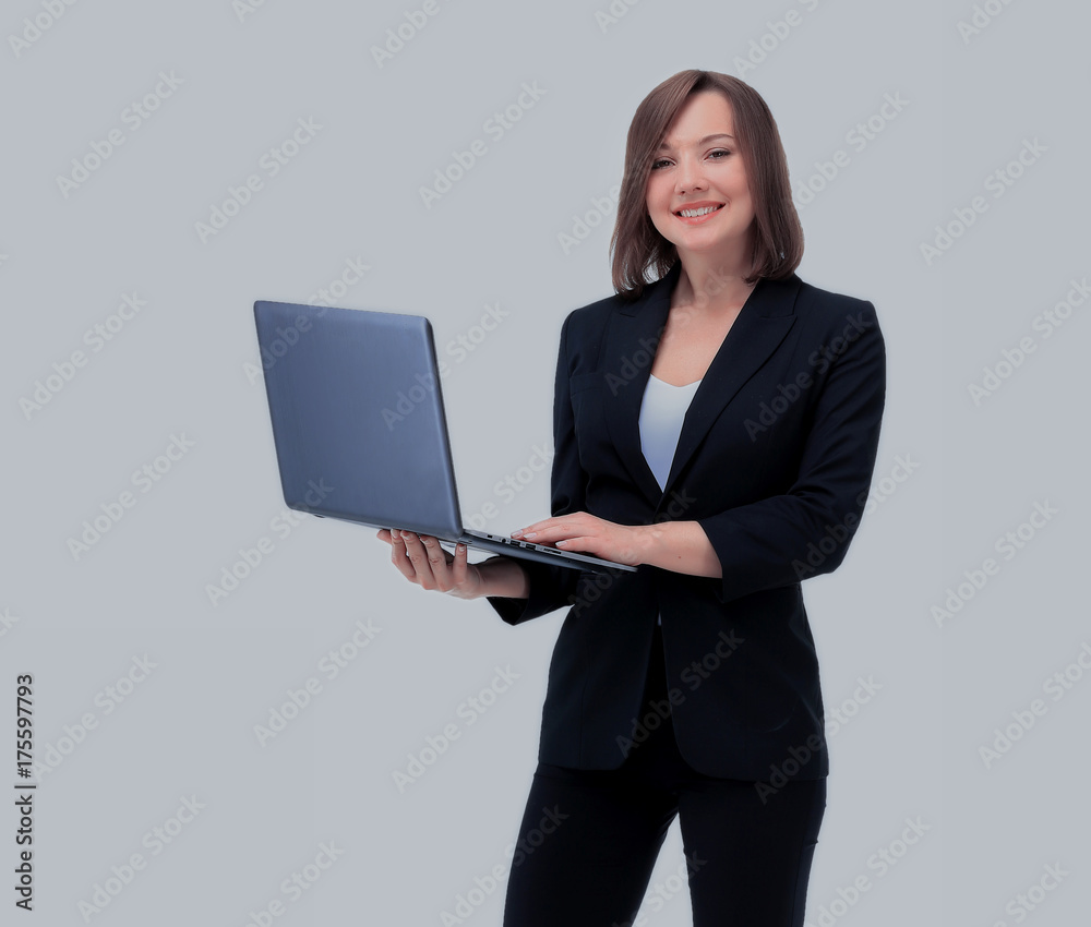 Beautiful businesswoman keeps the laptop. Beautiful businesswoman keeps the laptop.