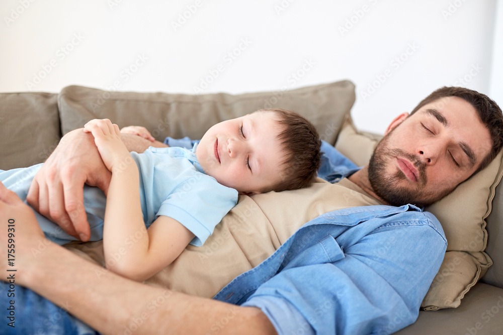 happy father and son sleeping on sofa at home happy father and son sleeping on sofa at home