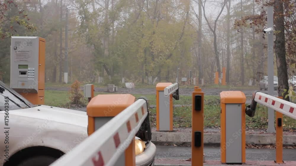 checkpoint three posts. Automatic road barrier gate lifting gate opens and passes car