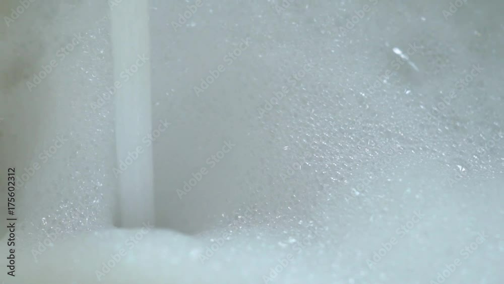 Water and foam in bath slowmotion
