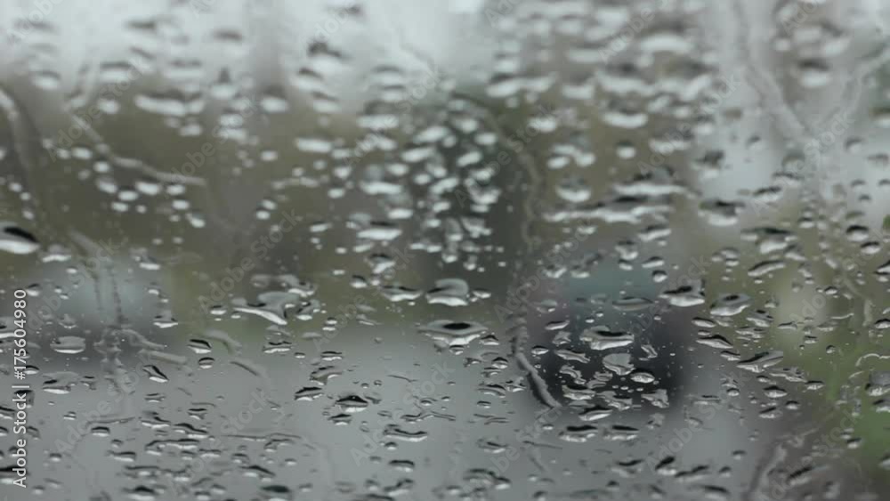 droplets on a windshield on the day snow with rain. blured background droplets on a windshield on the day snow with rain. blured background