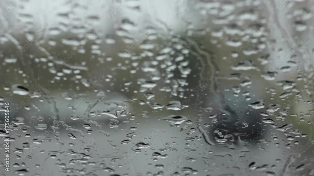 droplets on a windshield on the day snow with rain. blured background droplets on a windshield on the day snow with rain. blured background