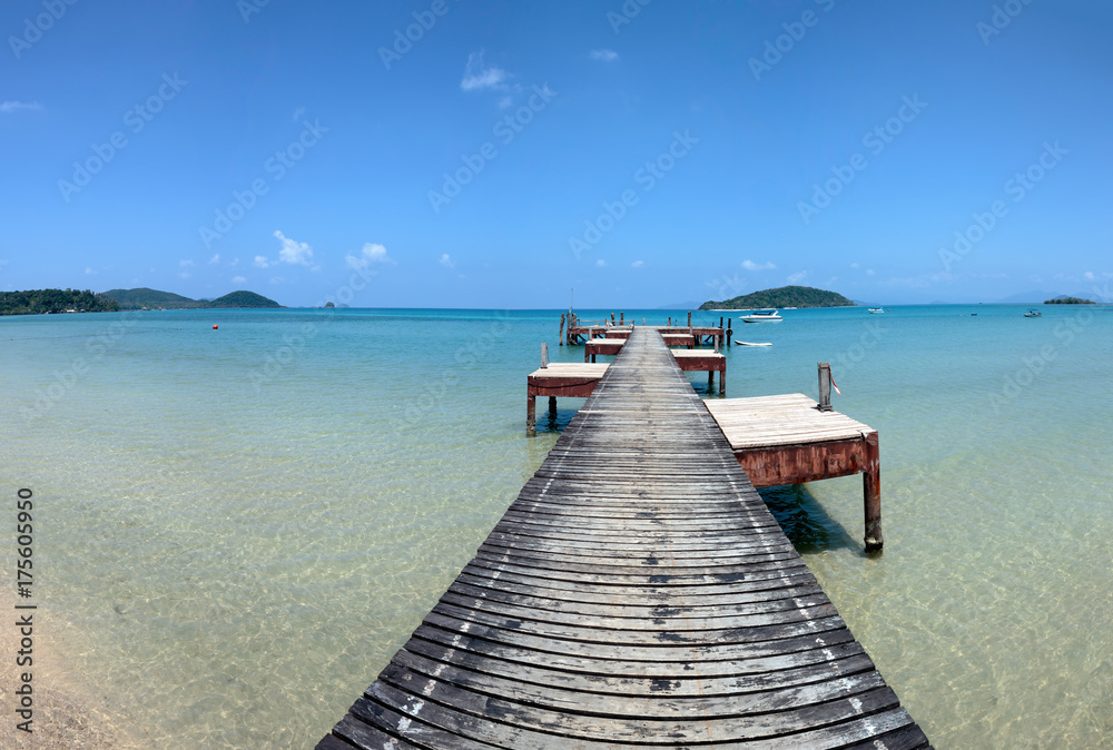 Old wooden pier on exotic beach island, Thailand