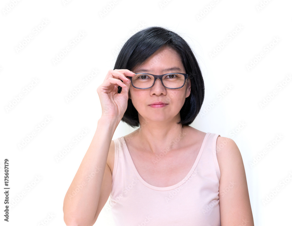 Portrait of Asian middle aged woman with clean skin short black hair wearing myopia or presbyopia eyeglasses isolated on white background. Beautiful Asian woman touch her glasses eyesight concept. Sto...