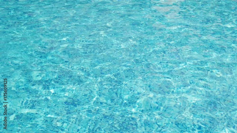 Water ripples on blue tiled swimming pool background. View from above. Water ripples on blue tiled swimming pool background. View from above.