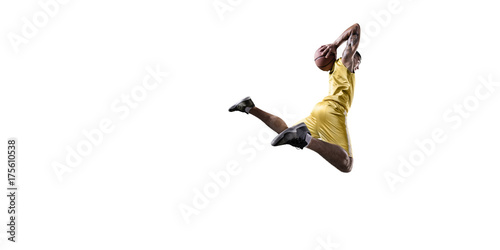 Basketball player makes slam dunk. Isolated basketball player on a white background. Player wears unbranded clothes.
