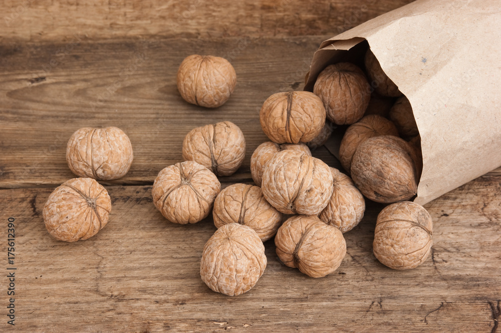 walnuts in a kraft paper bag walnuts in a kraft paper bag