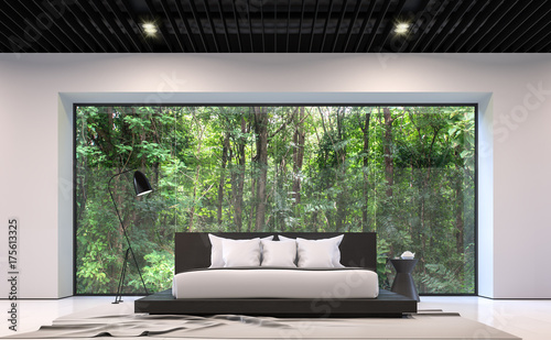 Modern black and white bedroom with forest view 3d rendering image.There are large window overlooking the surrounding garden and nature © onzon