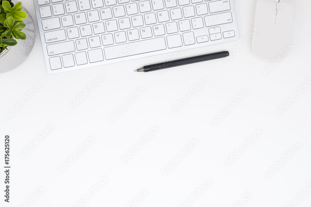 White office desk table with computer gadgets and pen. Top view with copy space, flat lay. White office desk table with computer gadgets and pen. Top view with copy space, flat lay.