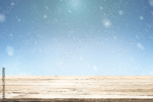 Wooden table for present product on bokeh background.