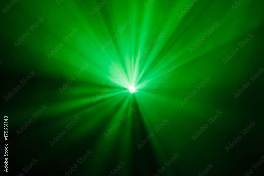 Fototapeta premium Rays theatrical spotlights on the stage during the performance. Lighting equipment. The lighting designer. Theatrical smoke. The art and creativity.