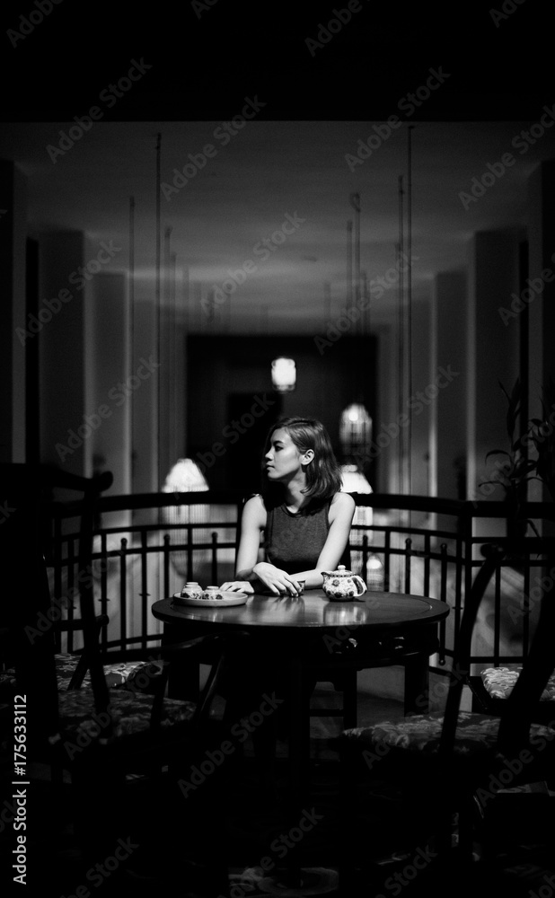 Beautiful Asian young woman drinking in Shanghai restaurant Beautiful Asian young woman drinking in Shanghai restaurant