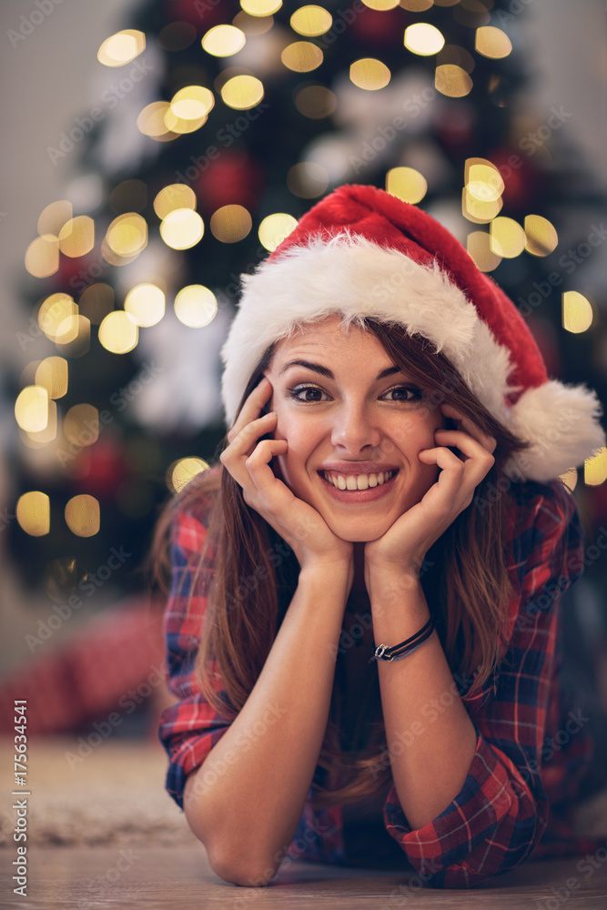 Girl with Santa Clause cap at Christmas eve Girl with Santa Clause cap at Christmas eve
