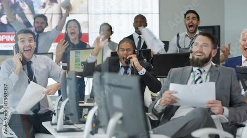  Financial traders in busy stock exchange celebrate making lots of money