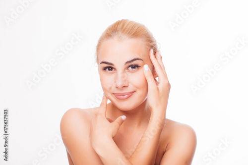 Portrait of young blond woman with clean face. High key shot.