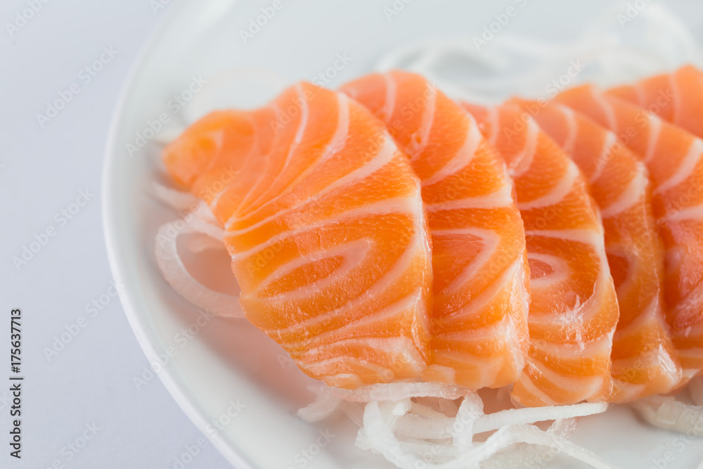 salmon sashimi, raw on a plate on a white background salmon sashimi, raw on a plate on a white background