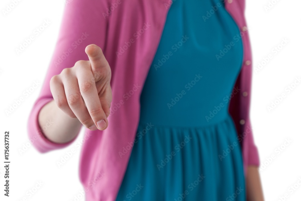 Teenage girl pressing an invisible virtual screen Teenage girl pressing an invisible virtual screen
