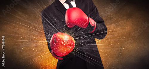 Forceful businessman boxing