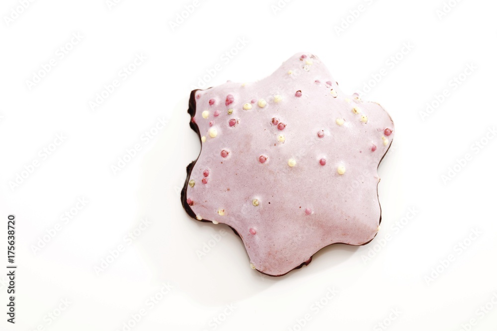 Sugar glazed gingerbread star biscuit with sugar pearls