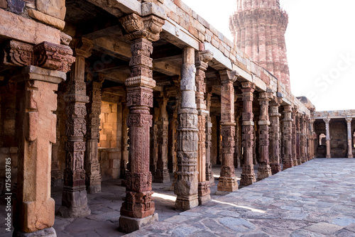 Qutub Minar, stone pillars with carvings of erstwhile Temples