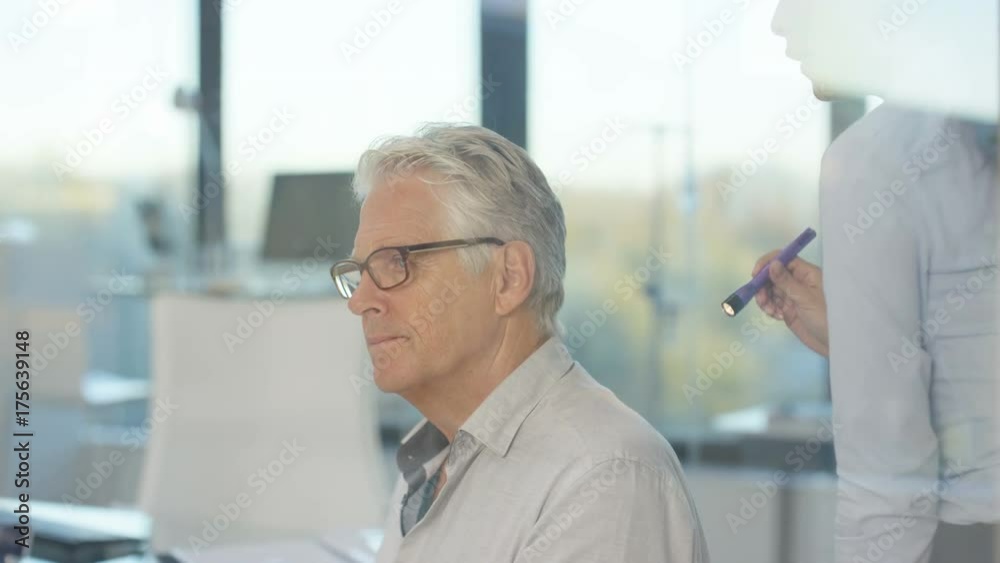 Audiology doctor examining a patient & explaining about hearing loss Audiology doctor examining a patient & explaining about hearing loss