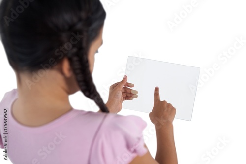 Fototapeta Naklejka Na Ścianę i Meble -  Girl using a glass digital tablet