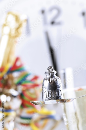 Photography Lead-pouring on New Year's Eve, clock showing 12:00, midnight
