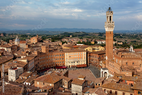 Siena, Tuscany, Italy. View of the Old Town - Piazza del Campo, Palazzo Pubblico di Siena, Torre del Mangia at sunset from Siena Cathedral (Duomo di Siena)