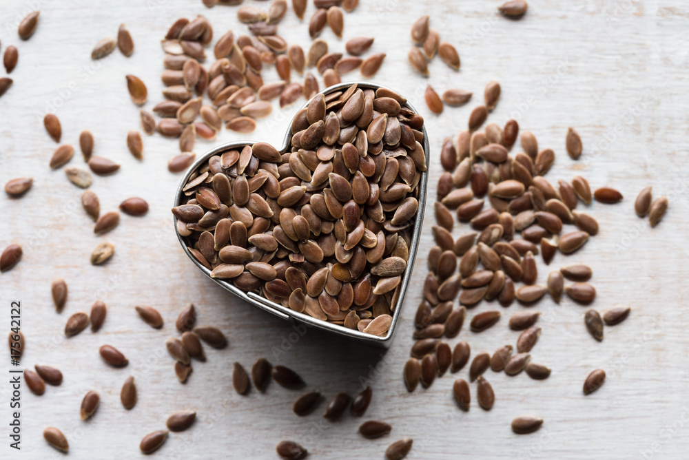 Brown Flaxseeds in a Heart Shape Brown Flaxseeds in a Heart Shape