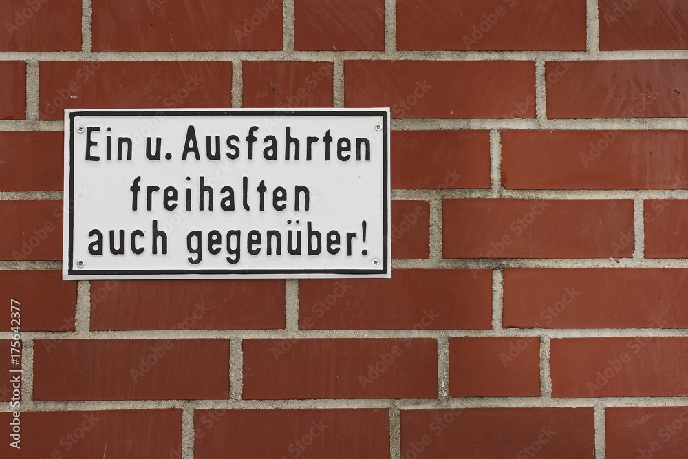 Keep entry and exit free also opposite! Instruction and order sign on a wall Keep entry and exit free also opposite! Instruction and order sign on a wall