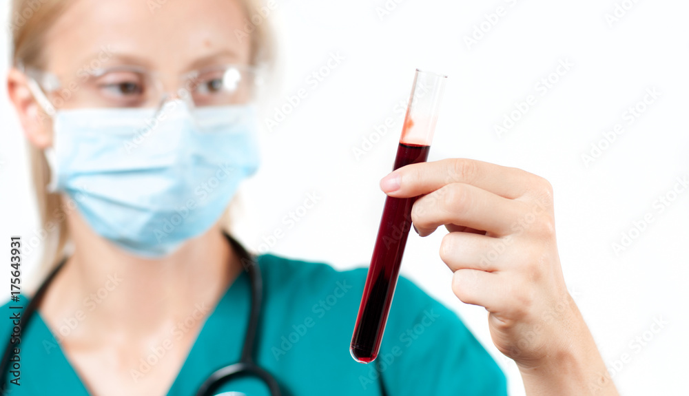 Female doctor doing the blood test Female doctor doing the blood test