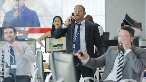  Financial traders watching the world markets react as the market crashes