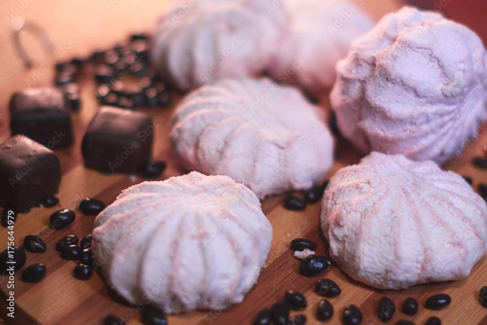 Marshmallow and other sweets on a wooden background still life. Marshmallow and other sweets on a wooden background still life.
