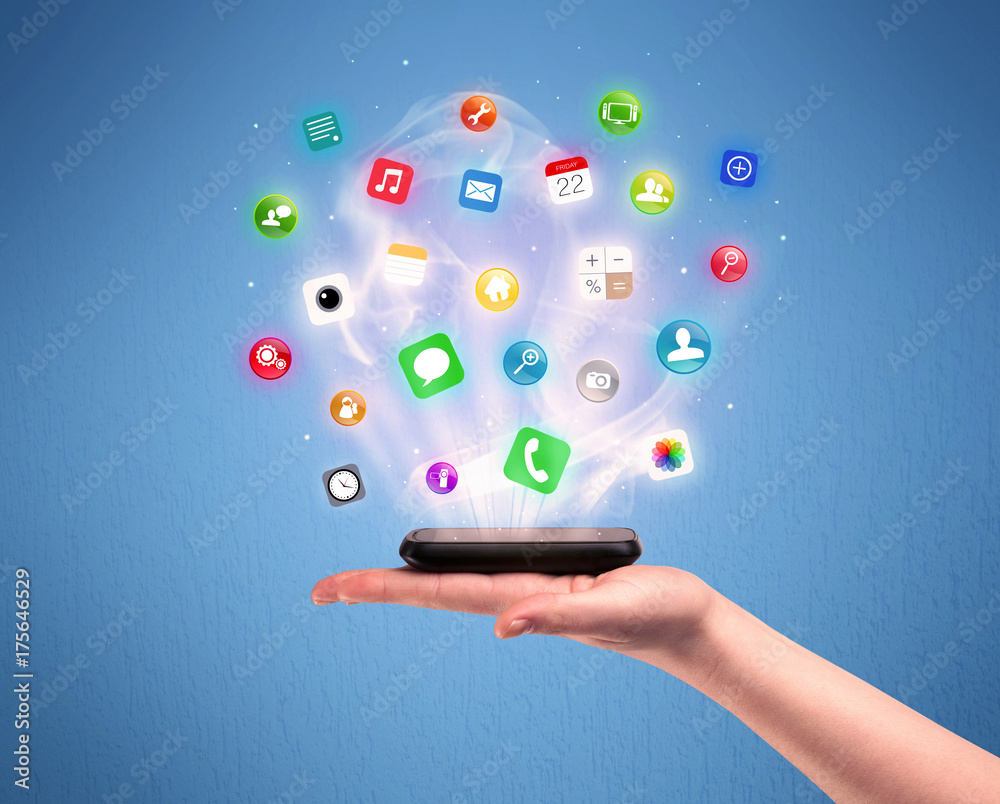 Hand holding tablet phone with app icons Hand holding tablet phone with app icons
