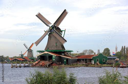 Traditional Dutch windmills on the water channel. Zaandam, the Netherlands. 