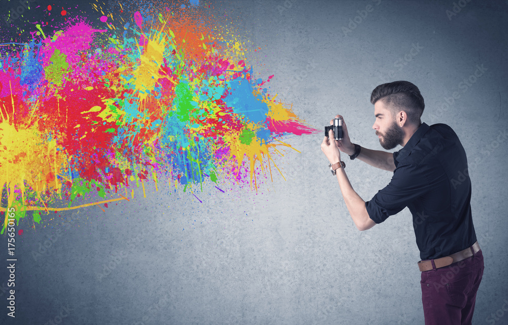 Hipster guy with camera and paint splash - obrazy, fototapety, plakaty 