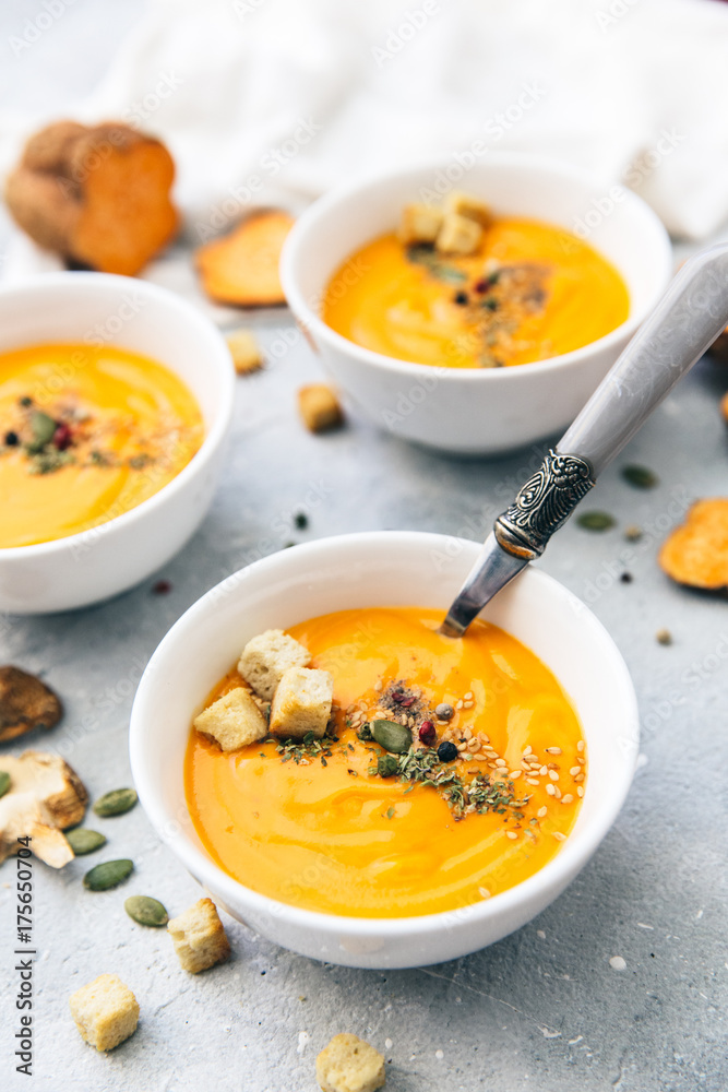 Fresh homemade soup. Carrot, sweet potato or pumpkin dish Fresh homemade soup. Carrot, sweet potato or pumpkin dish