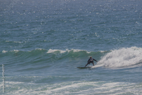 Canvas Print Man surfing waves at Newgale Beach in Wales UK