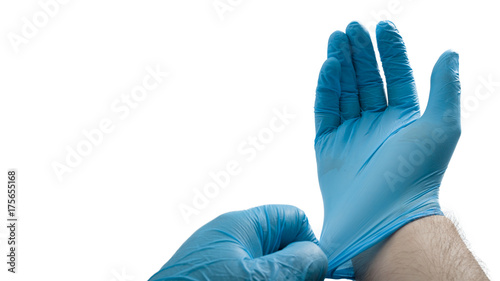 Medical professional and hospital staff concept with surgeon, doctor or nurse putting on blue surgical gloves isolated on white background with clipping path and copy space