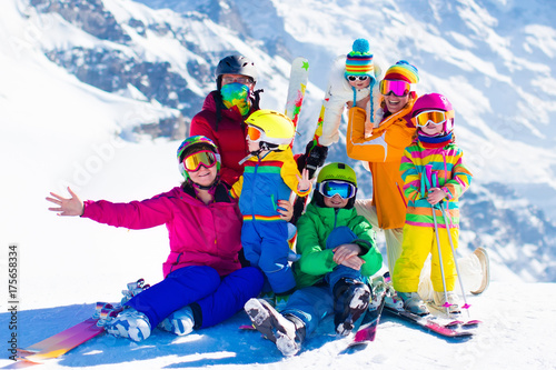 Ski and snow fun. Family in winter mountains.