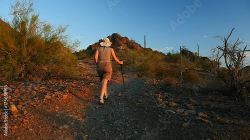 A Mature, active woman hiking in the desert alone