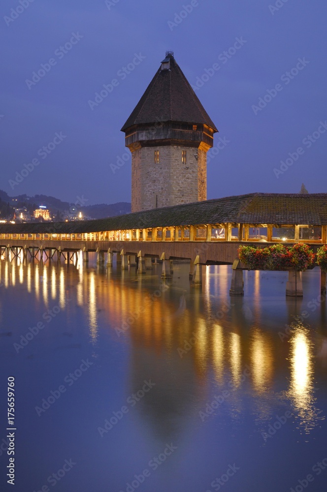 Kapellbruecke mit water tower at dusk, Lucerne, Switzerland, Europe