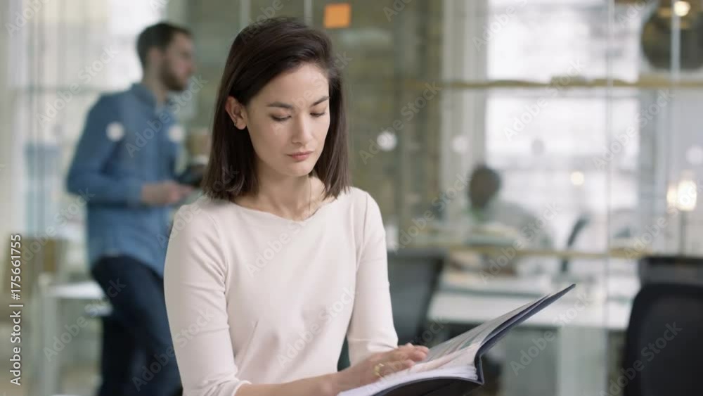Portrait smiling casual businesswoman in modern creative office Portrait smiling casual businesswoman in modern creative office