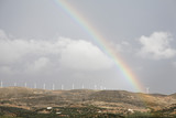 Rainbow above wind power plant near Palekastro, Eastern Crete, Greece, Europe