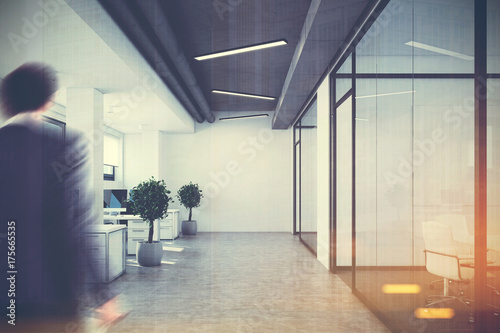 Open space office,glass and white walls, man © ImageFlow