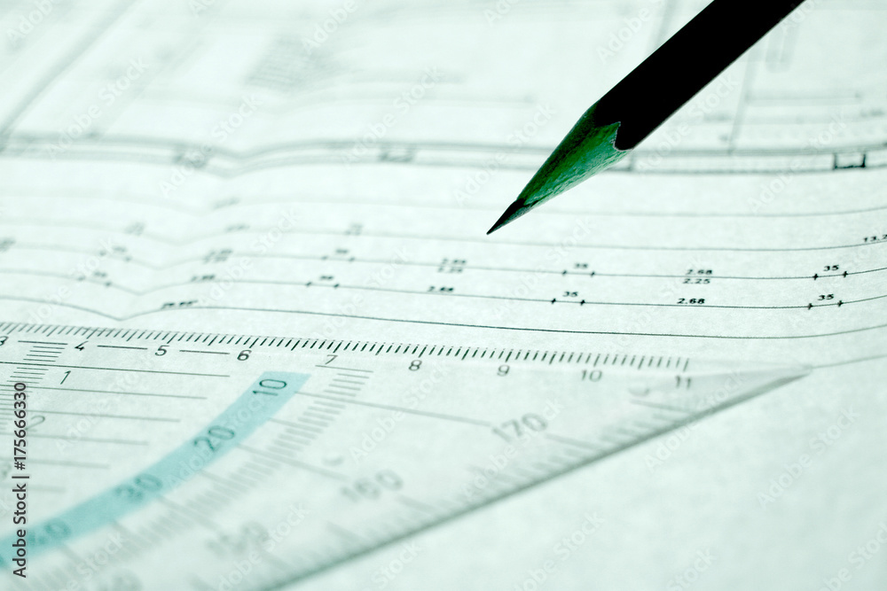 Pencil and set square on a construction plan Pencil and set square on a construction plan
