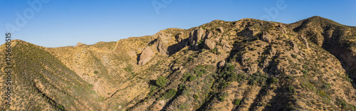 Rock boulders and ravines in the hills and mountains of the Mojave Desert and Angeles National Forest.